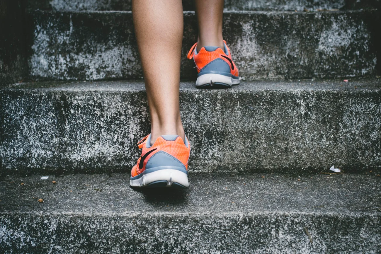 Runner climbing outdoor steps